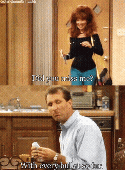 A Man Is Sitting At A Table With A Woman Standing Behind Him And Says " Did You Miss Me " With Every Bullet So Far GIF