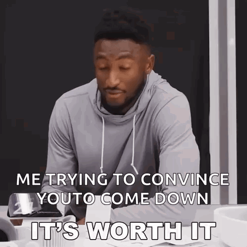 A Man Is Sitting At A Table With His Eyes Closed And Says It 'S Worth It GIF