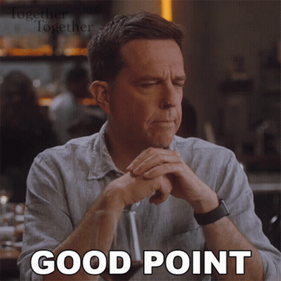 A Man Is Sitting At A Table With His Eyes Closed And The Words Good Point Written On His Face GIF