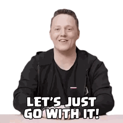 A Man Is Sitting At A Table With His Hands Folded And Says Let 'S Just Go With It Sticker