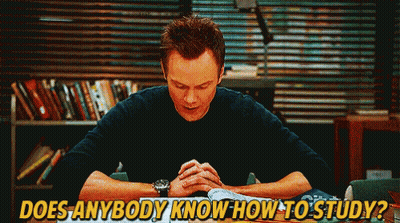 A Man Is Sitting At A Table With His Hands Folded And The Words " Does Anybody Know How To Study " Below Him GIF