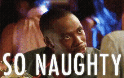 A Man Is Sitting At A Table With The Words So Naughty Written Above Him GIF