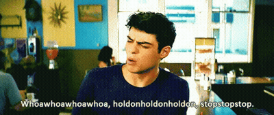 A Man Is Sitting At A Table With The Words Whoawhoawhoa Whoa Holdonholdon Holdon Stopstopstop GIF