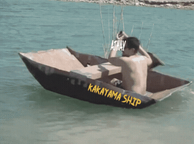 A Man Is Sitting In A Boat That Says Kakayama Ship GIF