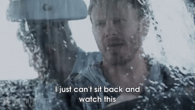 A Man Is Sitting In A Car Looking Out The Window And Says I Just Can 'T Sit Back And Watch This . GIF