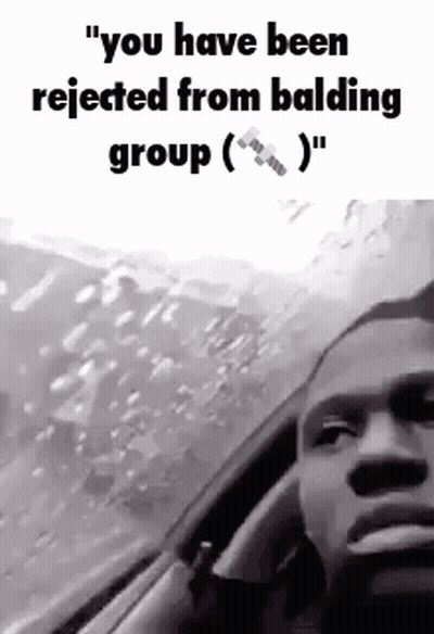 A Man Is Sitting In A Car Talking On A Cell Phone . GIF
