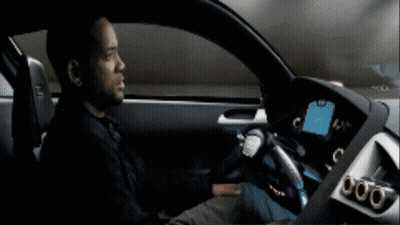 A Man Is Sitting In A Car With A Dashboard That Says 000 GIF
