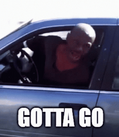 A Man Is Sitting In A Car With Gotta Go Written On The Side GIF