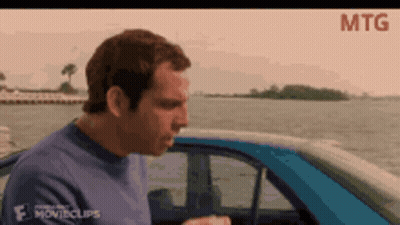 A Man Is Sitting In A Car With The Word Mtg On The Bottom Right GIF