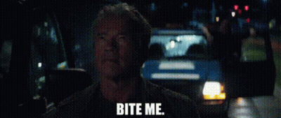 A Man Is Sitting In A Car With The Words `` Bite Me '' Written On The Screen . GIF