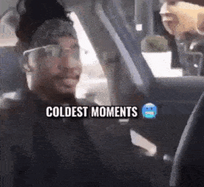 A Man Is Sitting In A Car With The Words Coldest Moments On The Screen . GIF