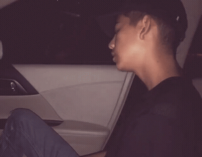 A Man Is Sitting In A Car With The Words Day After Day Behind Him GIF