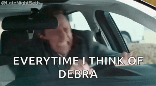 A Man Is Sitting In A Car With The Words Everytime I Think Of Debra GIF
