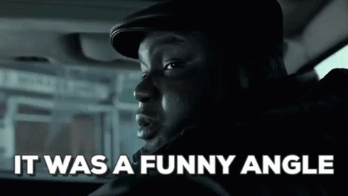 A Man Is Sitting In A Car With The Words `` It Was A Funny Angle '' Written On The Screen . GIF