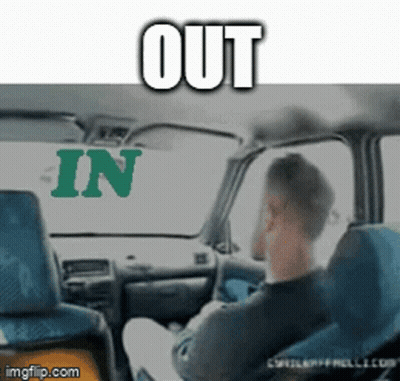 A Man Is Sitting In A Car With The Words Out And In Behind Him GIF