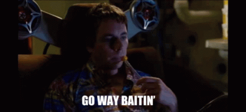 A Man Is Sitting In A Chair Eating A French Fry And Saying Go Way Baitin GIF