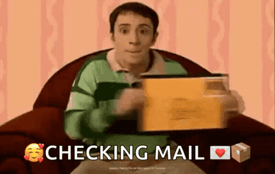 A Man Is Sitting In A Chair Holding An Envelope With The Words Checking Mail Below Him GIF