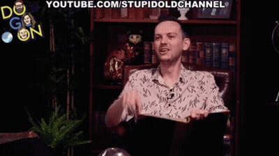 A Man Is Sitting In A Chair With A Book In His Hand And The Word Toot Is Behind Him GIF