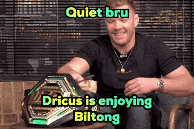 A Man Is Sitting In A Chair With A Ufc Belt On His Lap And The Caption Quiet Bru GIF