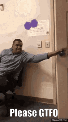 A Man Is Sitting In A Chair With His Arm Outstretched And The Words Please Gtfo On The Bottom GIF