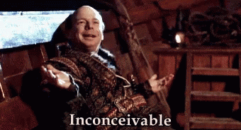 A Man Is Sitting In A Chair With His Arms Outstretched And The Words Inconceivable Written Below Him . GIF