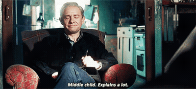 A Man Is Sitting In A Chair With His Eyes Closed And Says Middle Child Explains A Lot . GIF