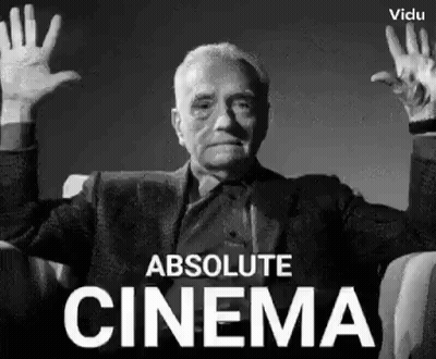 A Man Is Sitting In A Chair With His Hands Up In The Air . GIF