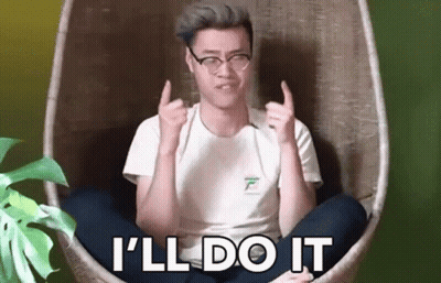 A Man Is Sitting In A Chair With His Legs Crossed And Giving A Thumbs Up Sign . GIF