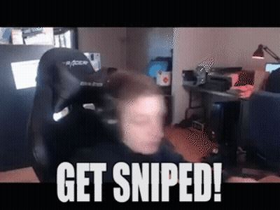 A Man Is Sitting In A Chair With The Words Get Sniped On The Bottom GIF