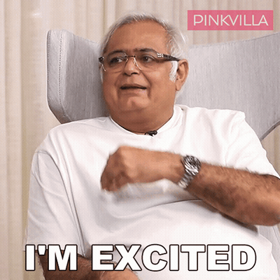 A Man Is Sitting In A Chair With The Words " I 'M Excited " On The Bottom GIF
