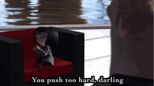 A Man Is Sitting In A Chair With The Words " You Push Too Hard Darling " Written Above Him GIF