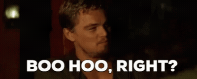 A Man Is Sitting In A Dark Room With The Words `` Boo Hoo , Right ? '' Above Him . GIF