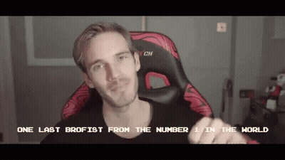 A Man Is Sitting In A Gaming Chair With The Words One Last Brofist From The Number 1 In The World Written On The Screen  GIF
