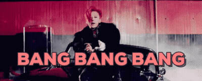 A Man Is Sitting In A Red Car With The Words Bang Bang Bang Above Him GIF