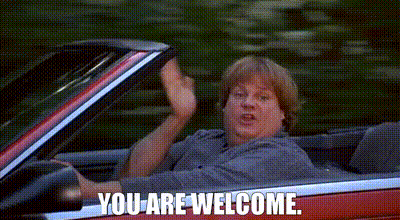 A Man Is Sitting In A Red Convertible Car And Waving . GIF