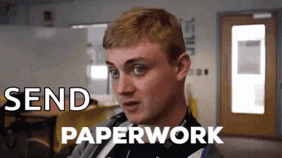 A Man Is Sitting In A Room With The Words Send Paperwork Written On The Screen . GIF