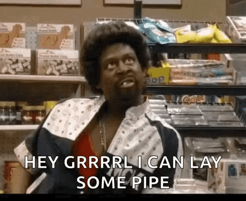 A Man Is Sitting In A Store And Saying `` Hey Grrrl I Can Lay Some Pipe '' GIF
