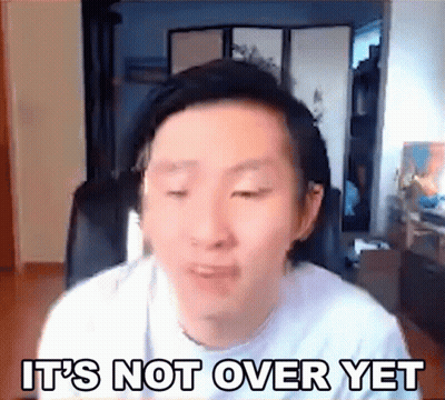 A Man Is Sitting In Front Of A Computer Screen With The Words `` It 'S Not Over Yet '' Written On The Screen . GIF