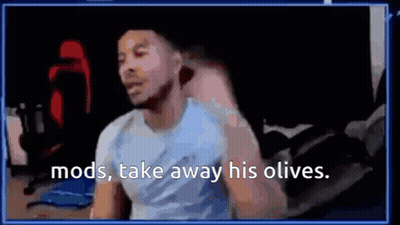 A Man Is Sitting In Front Of A Computer Screen With The Words `` Mods , Take Away His Olives '' Written On It . GIF
