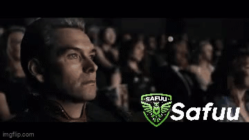 A Man Is Sitting In Front Of A Crowd Watching A Movie . GIF