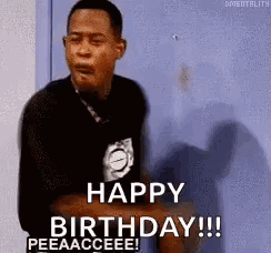 A Man Is Sitting In Front Of A Door And Saying `` Happy Birthday !!! '' GIF