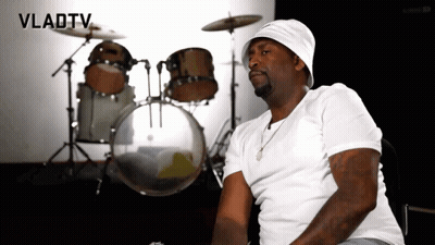 A Man Is Sitting In Front Of A Drum Set With Vladtv Written On The Bottom GIF
