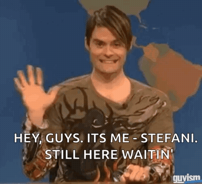 A Man Is Sitting In Front Of A Map Of The World And Waving His Hand . GIF