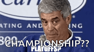 A Man Is Sitting In Front Of A Microphone And Saying `` Championship ? '' . GIF