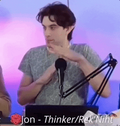 A Man Is Sitting In Front Of A Microphone With The Words Jon - Thinker / Rek ' Niht Above Him GIF