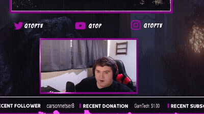 A Man Is Sitting In Front Of A Screen That Says Qtoptv On It GIF