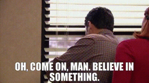 A Man Is Sitting In Front Of A Window With Blinds And Saying `` Oh , Come On , Man Believe In Something . '' GIF