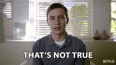 A Man Is Sitting In Front Of A Window With Blinds And Says That 'S Not True GIF