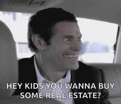 A Man Is Sitting In The Back Seat Of A Car And Smiling . GIF