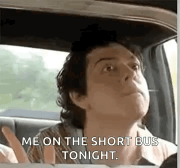 A Man Is Sitting In The Back Seat Of A Car Talking To Someone . GIF